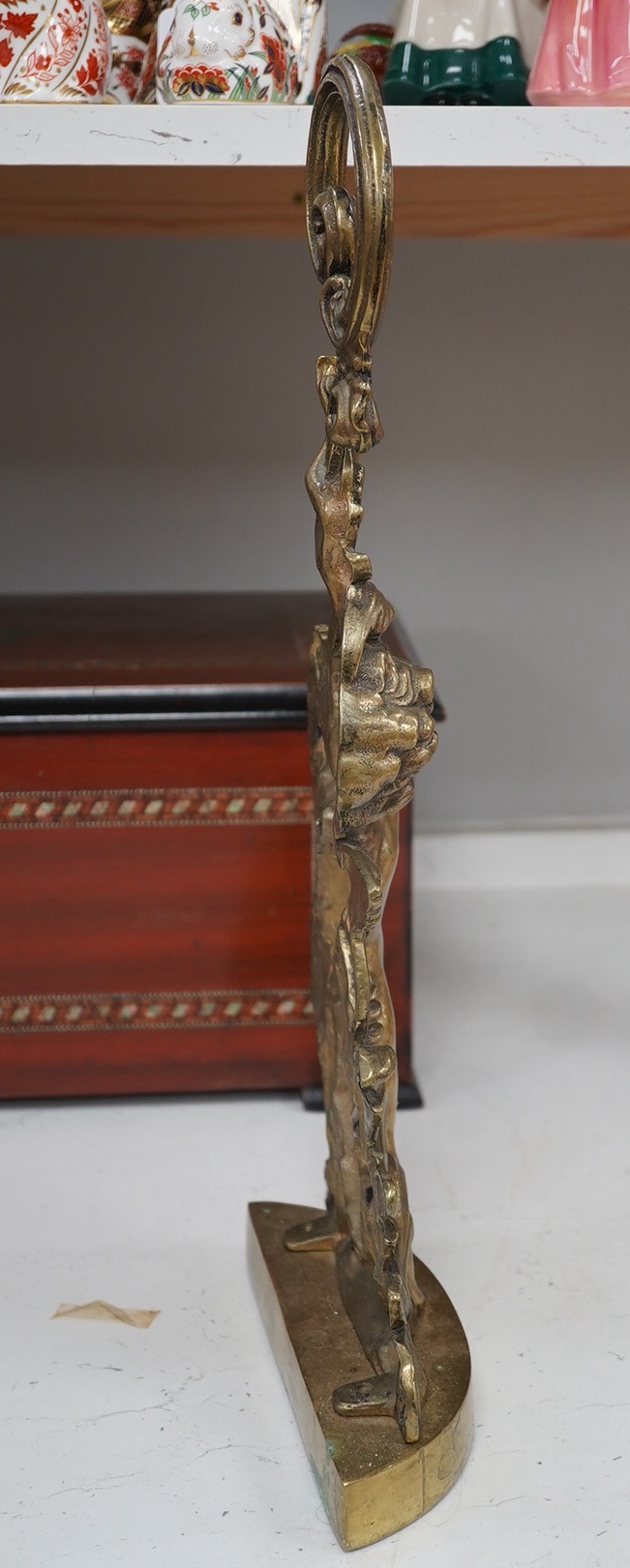 A Victorian style brass cherubic doorstop, 49cm high. Condition - some scratches to base.